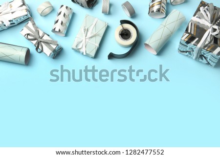 Flat lay composition with beautiful gift boxes and space for text on color background