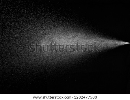 close up of spray water on black background Royalty-Free Stock Photo #1282477588