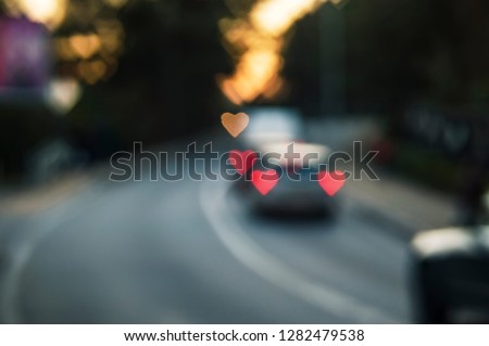 Road to defocus lights cars heart motorcycle in the evening