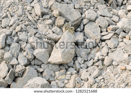 Crushed rock Different shapes and sizes for background . Stone gravel texture use for background, crushed rock for construction. pure gray rock. many rock background.