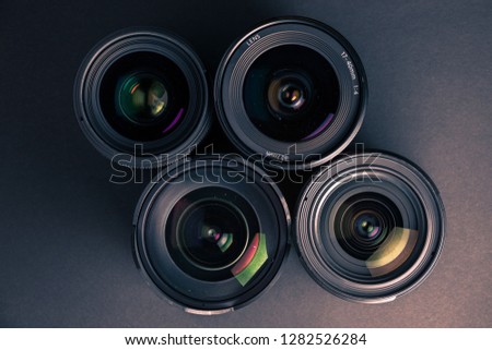 Set of various DSLR lenses with colorful reflections