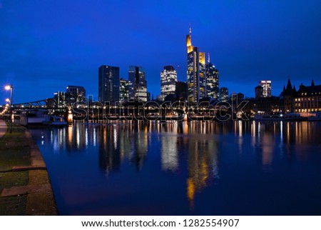 Blue Hour at the Main River with the Frankfurt skyline reflected by the water,Hesse, Germany 