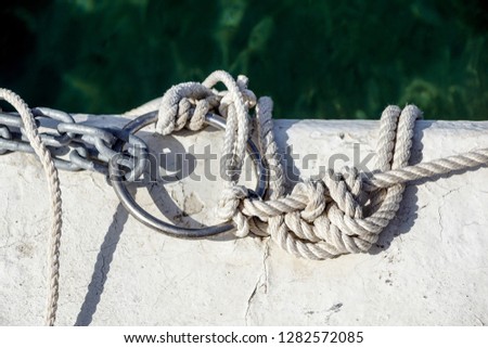 The turns of the white twisted nylon ship rope