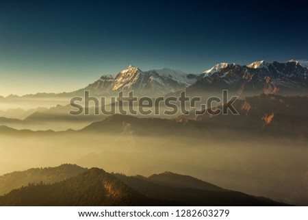 Beautiful view at Poon Hill with Dhaulagiri Peaks in background at sunset. Himalaya Mountains, Nepal. Royalty-Free Stock Photo #1282603279