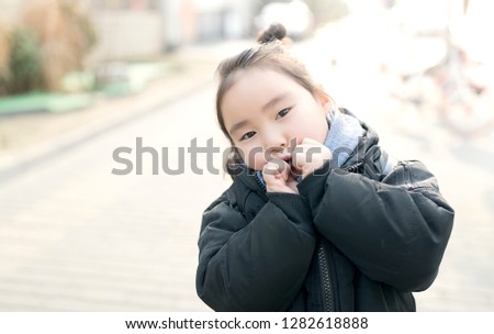 Lovely Asian girl in outdoor sunshine