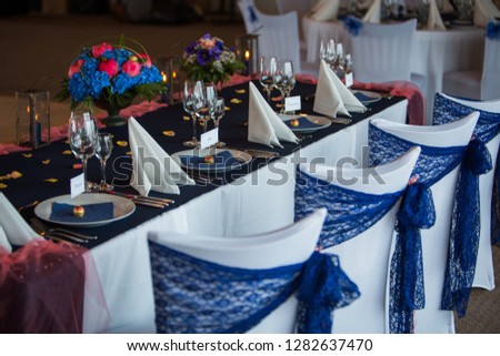 decorated wedding table in white and blue Royalty-Free Stock Photo #1282637470