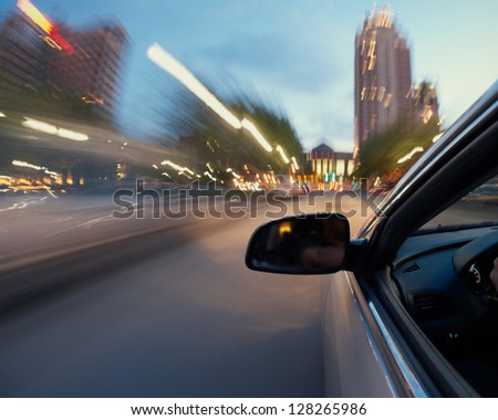 Motion blur of moving car in city