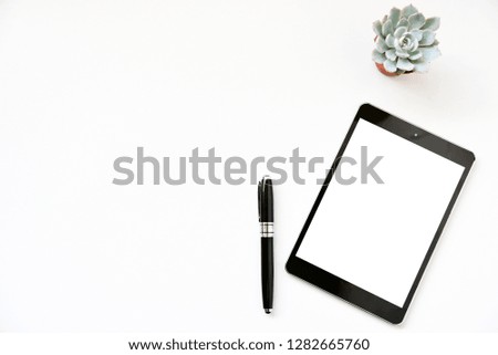 Top view tablet,smartphone ,mouse and keyboard on office desk.Top view with copy space