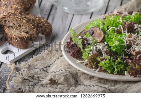 Homemade bio salad lettuce with mushrooms, simple and delicious food, food photography
