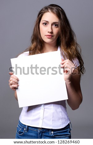 Woman with a white billboard in her hand