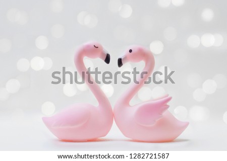 Flamingo couple in love with shiny light for Valentine's day or Wedding concept