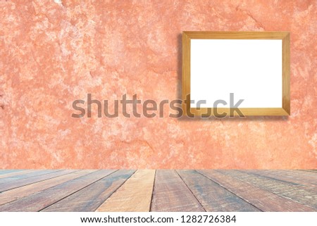 Orange wall and empty wood desk and Wooden frame .Blank space for text and images.