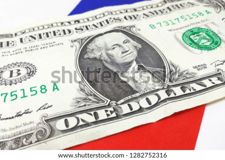One American dollar banknote on Russian flag background. Close up photography, concept of money exchange