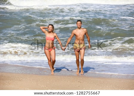 
couple of lovers dancing by the sea