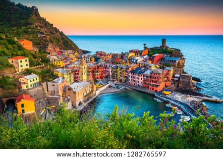 Majestic touristic village on the hill with colorful mediterranean buildings. Fantastic travel and photography place at sunset, Vernazza, Cinque Terre National Park, Liguria, Italy, Europe Royalty-Free Stock Photo #1282765597