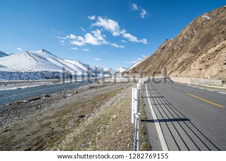  highway and snow mountain road through the grand canyon xinjiang  Duku