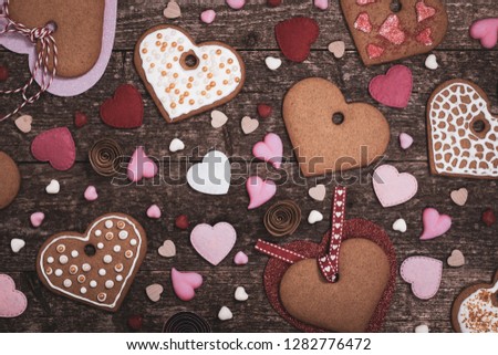 Valentines Day Heart Shaped Cookies on Wooden Background Photo in retro style. Toned image. Selective focus.