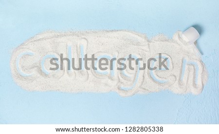 blue background with collagen powder close up Royalty-Free Stock Photo #1282805338