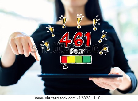 Poor credit score theme with woman using her tablet