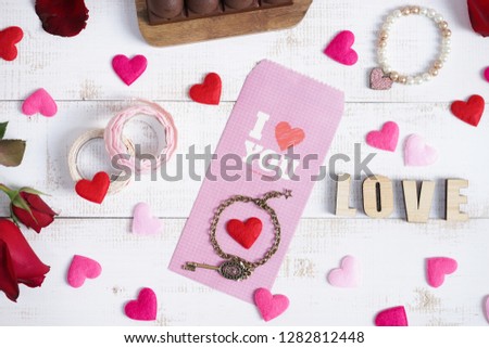 Valentines' day concept or surprise anniversary gift for girlfriend on the wooden vintage background.
