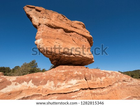 Red balanced Rock against a clear blue sky in the Garden of the Gods Park in Colorado Springs, Colorado.