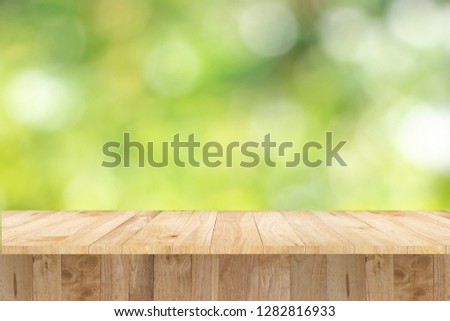 table display product and natural green  blurlight background Royalty-Free Stock Photo #1282816933