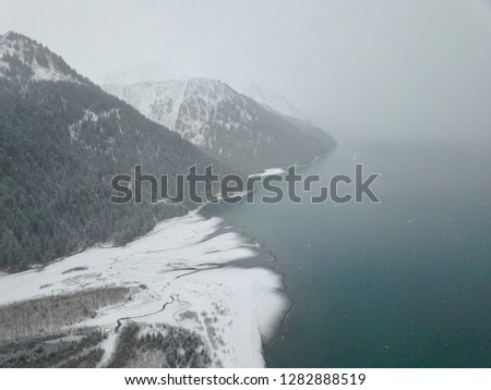 Aerial views of low tide in areas on Resurrection Bay Alaska during a winter storm