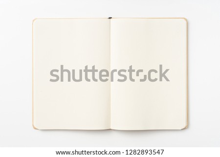 Design concept - Top view of kraft paper notebook, white page isolated on background for mockup