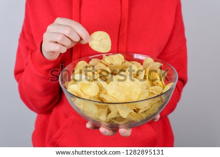 Cinema rest relax chill free time break leisure concept. Cropped closeup photo of cheerful excited glad nice person teen holding big bowl in hands isolated gray background