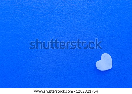 White heart shape on a blue background