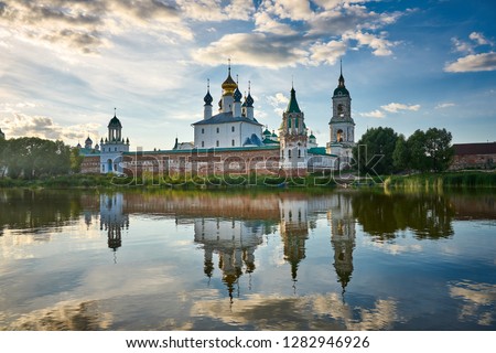 Spaso-Yakovlevsky Monastery - Monastery of St. Jacob Saviour, white clouds and reflections on Lake Nero. Landscape photo was taken at sunset, near Rostov the Great, Golden Ring, Russia.     
