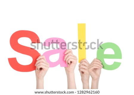 Hands holding the word Sale on white background