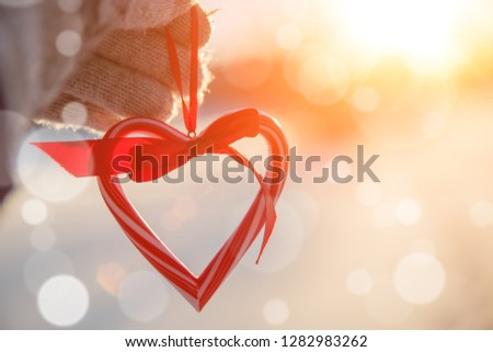 Love in winter. Heart shaped symbol Valentine Day. heart with ha