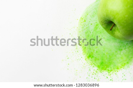 Green raw apple on hand drawn watercolor background of chartreuse yellow color mixture with splashes paintbrush strokes. Mixed media image combination of photography illustration. Creative food banner