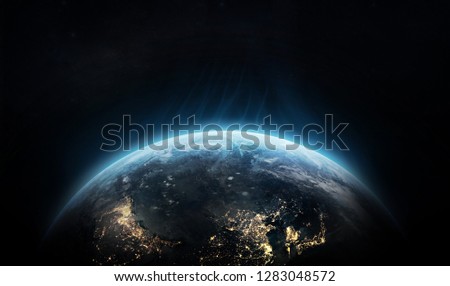 Planet Earth on black space background. Flash waves over the planet. Elements of this image furnished by NASA