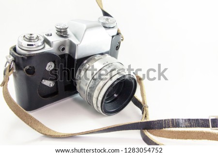 Old camera in a leather case on a white background.
Mechanical retro camera silver.