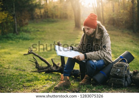 Young blogger photographer travel in mountain forest