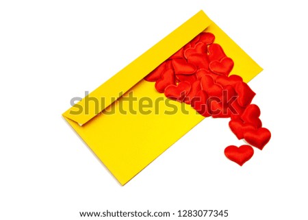 Gold envelope and red hearts crawling out of it. On an isolated white background, the concept of love in the distance