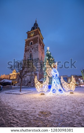 Krakow, Poland, Christmas decoration on Main Market Square and Town Hall tower