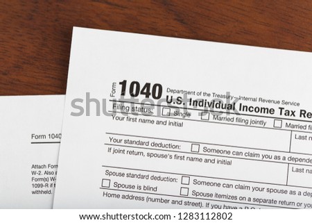 Income Tax Return Form 1040 on desk, 2019 version.  Royalty-Free Stock Photo #1283112802