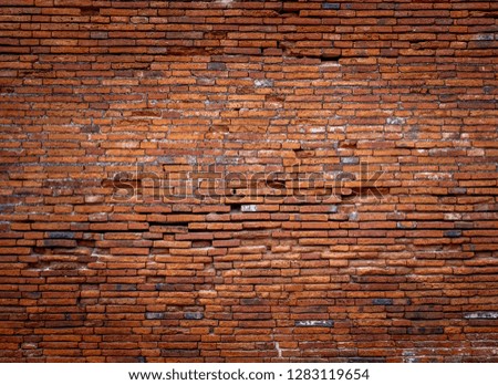 Antique brown brick wall of red color.texture grunge background.may use to interior design.