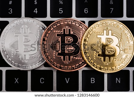 Coins bitcoin money currency financial on laptop keyboard