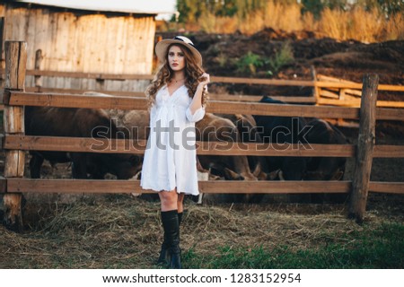 The girl in the white dress on the farm. toning