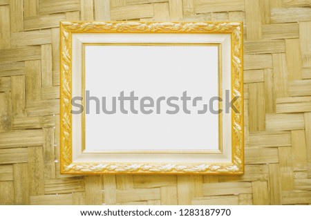Steel gold picture frame  decorative hanging on  wood woven wall background