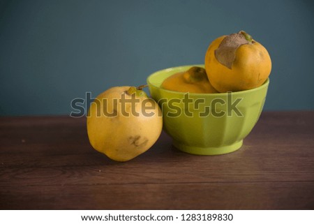 Ripen and yellow Quince or Membrillo  fruit with a leave
