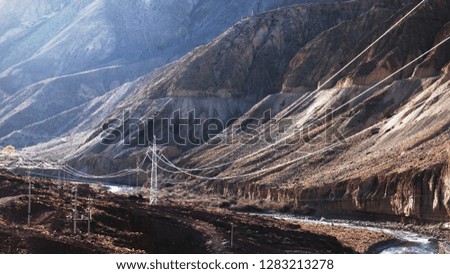 tibet mountain with electric tower