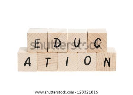 Education spelled out with wooden blocks. White background.