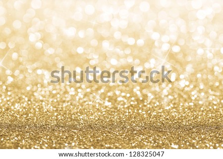 Gold defocused glitter background with copy space