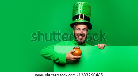 Lucky Patricks day. Happy St Patricks Day concept with pot of gold. Patricks board for Copy space. Patricks Day Pot of Gold and shamrocks. Banner or card