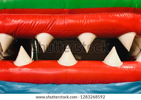 Muzzle of a bouncy castle crocodile